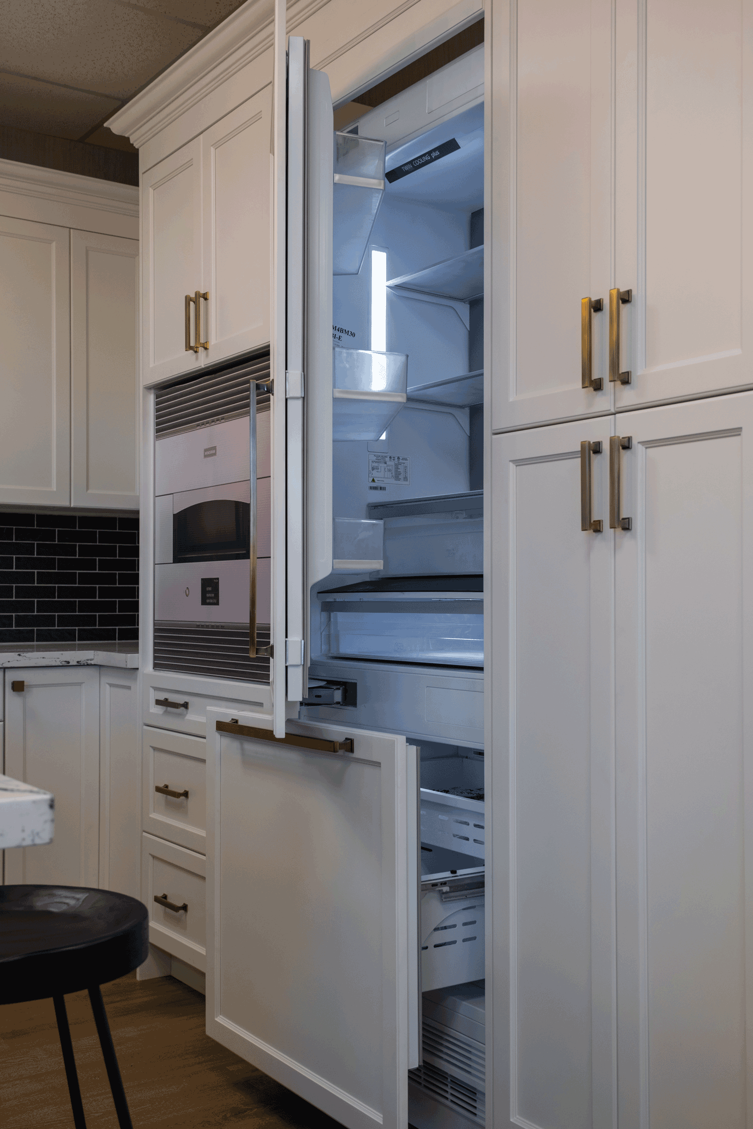 Completed modern kitchen renovation in Moncton featuring custom white shaker cabinets by RenoMe